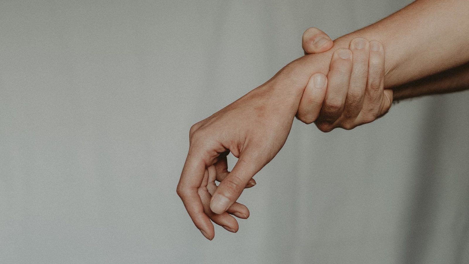 person grabbing their partner's wrist