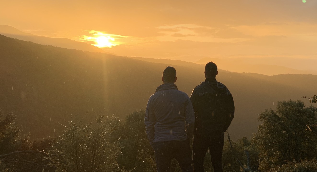 gay couple overlooking mountain